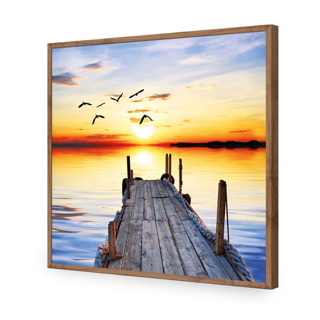 Stretched canvas wall art of an abandoned jetty at sunset, showcasing serene water and flying birds.