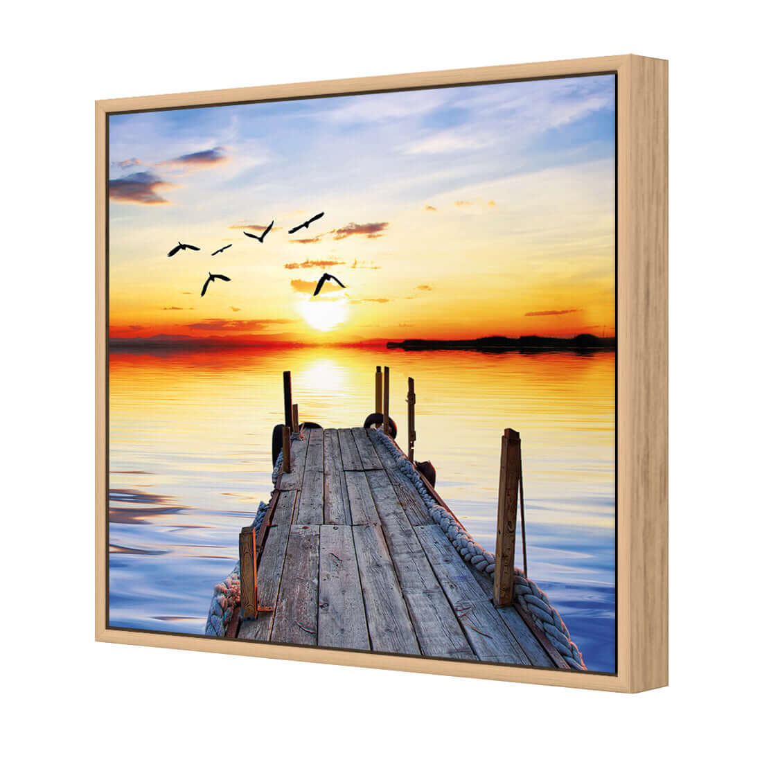 Stretched canvas wall art featuring an abandoned jetty at sunset with birds flying over calm waters.