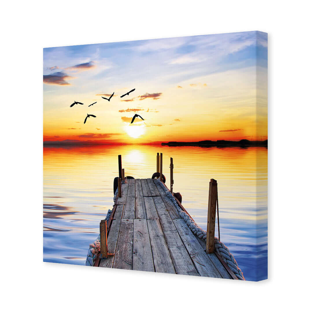 Abandoned jetty wall art, stretching into a serene sunset over calm waters with birds in flight, perfect for home decor.